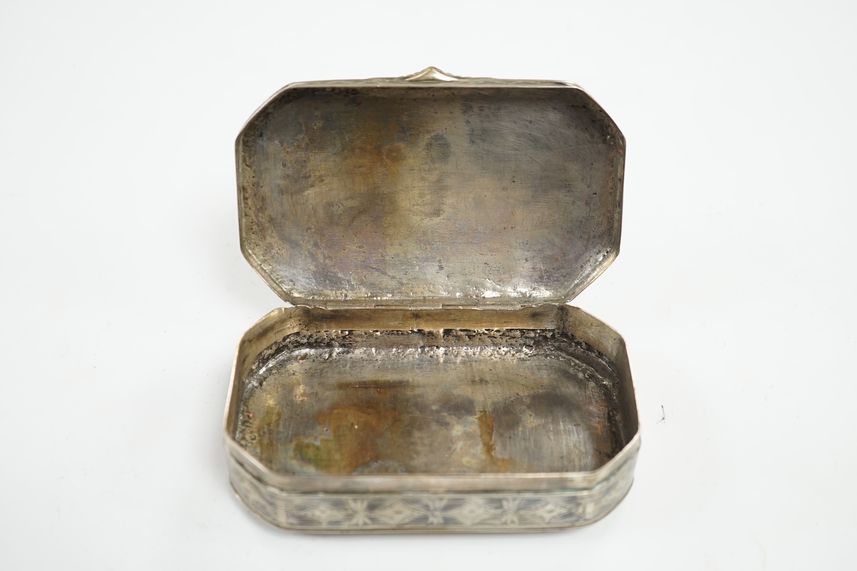 A continental white metal and niello octagonal box, 10.9cm. Condition - poor to fair